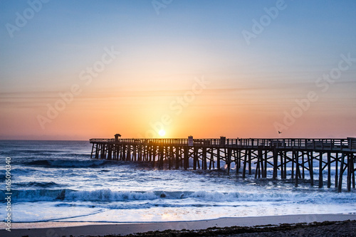 Ocean sunrise in Florida behind the fishing pier