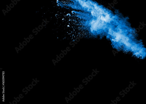 Launched blue powder, isolated on black background