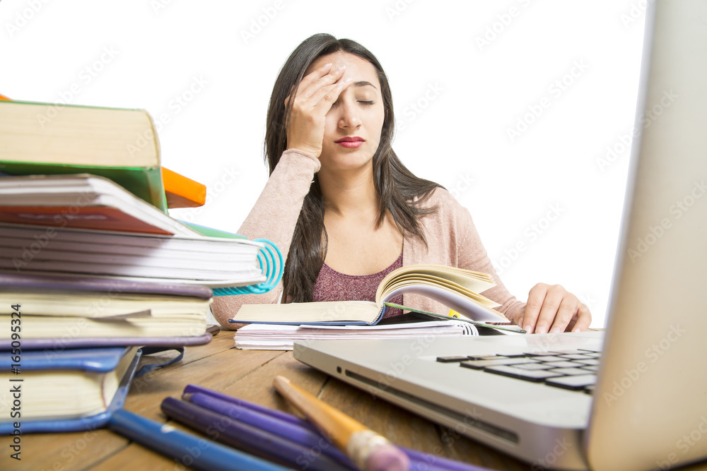 Female student in exams with books Female student in exams with books