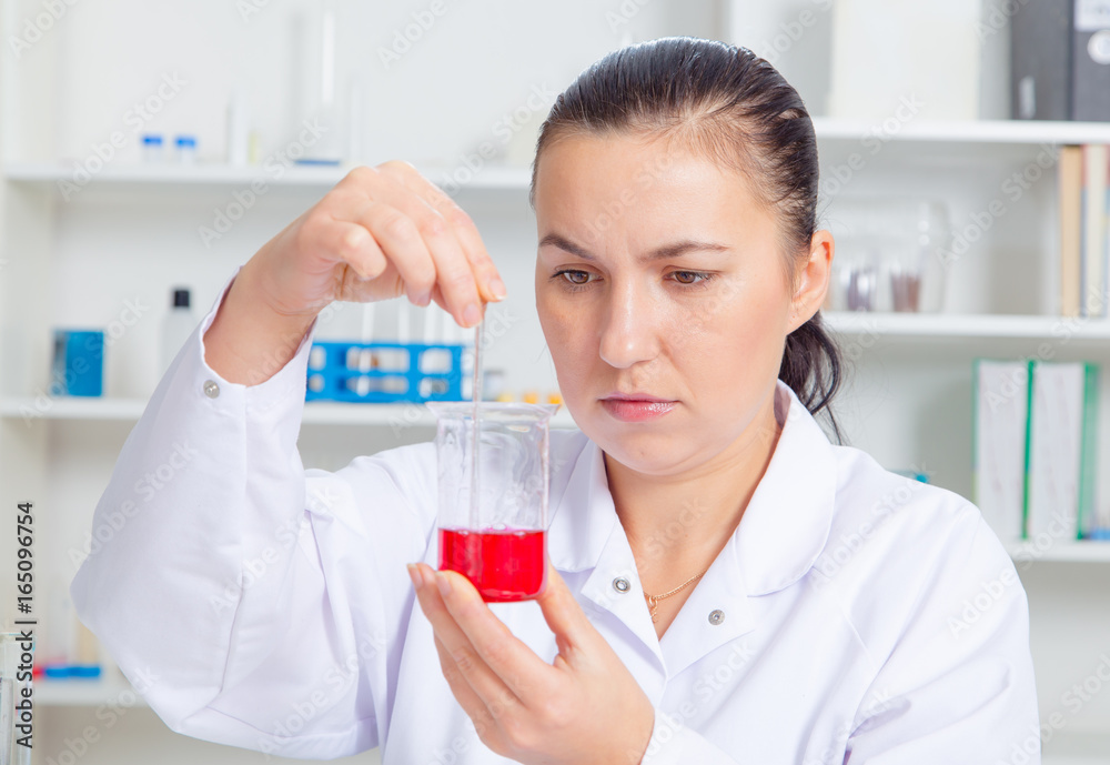 Young female scientist in lab , doing experiments in lab. Young female scientist in lab , doing experiments in lab.