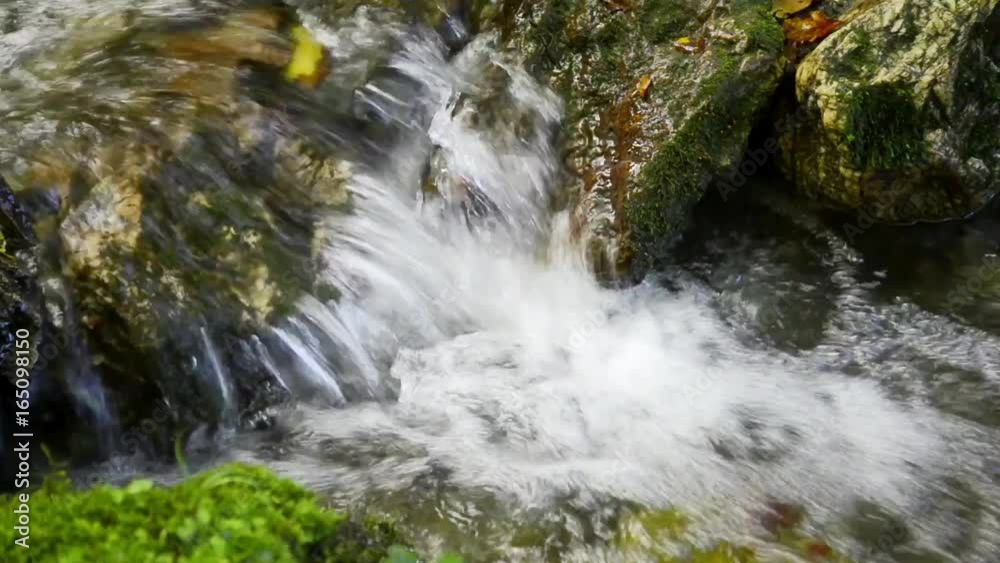 Small waterfall in a forest mountain creek Small waterfall in a forest mountain creek