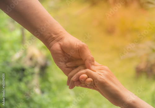 Two pairs of hand touch together, helping hands concept. Helping hand outstretched for help. © krisana