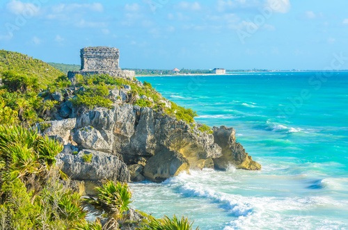 Mayan ruins of Tulum at tropical coast. God of Winds Temple at paradise beach. Mayan ruins of Tulum, Quintana Roo, Mexico.