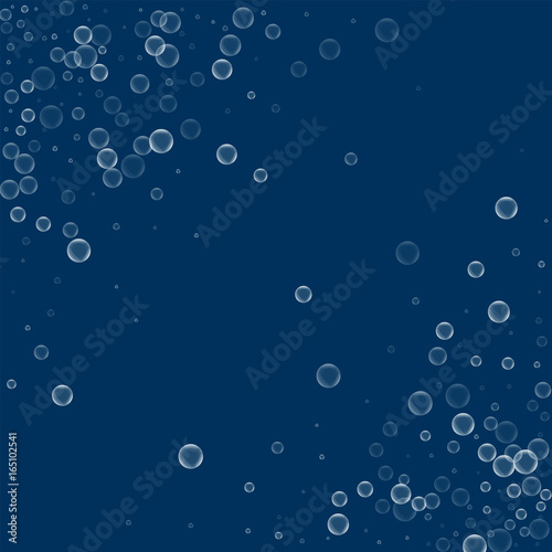 Soap bubbles. Abstract chaotic scatter with soap bubbles on deep blue background. Vector illustration.