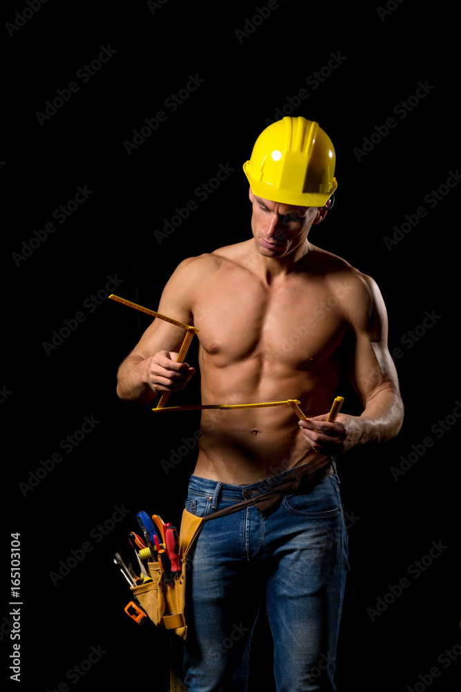 sexy fit shirtless worker with saw and tools sexy fit shirtless worker with saw and tools