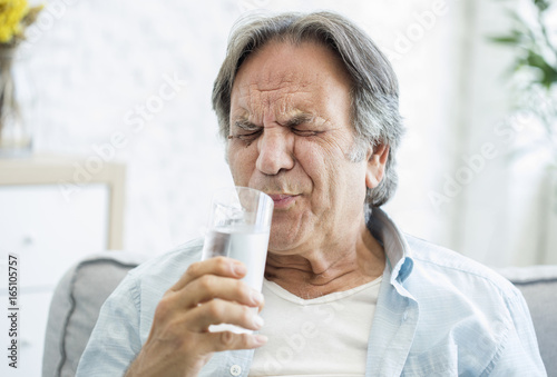 Old man with tooth sensitivity