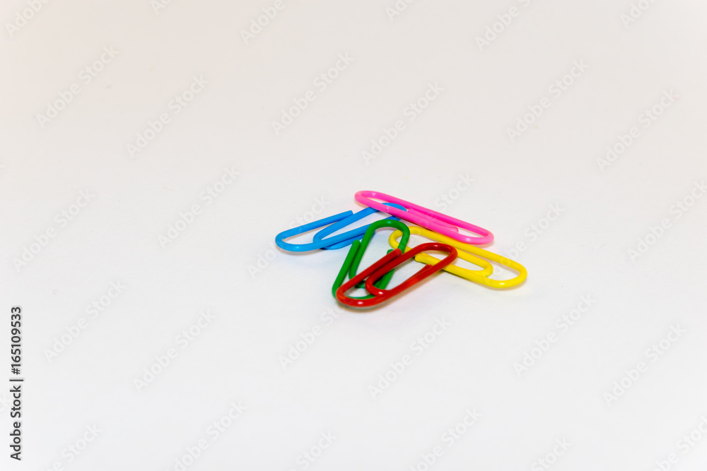 Colorful paper clips on white background Colorful paper clips on white background