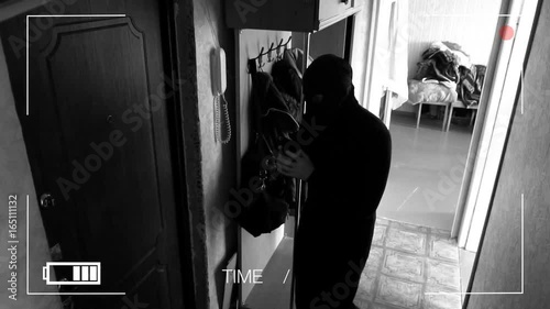 Real surveillance cameras caught and recorded the burglar breaking into the house,saw someone and runs away.