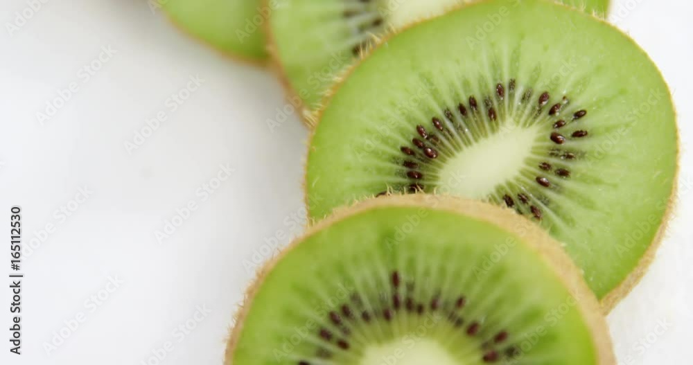 Kiwi slices on white background Kiwi slices on white background
