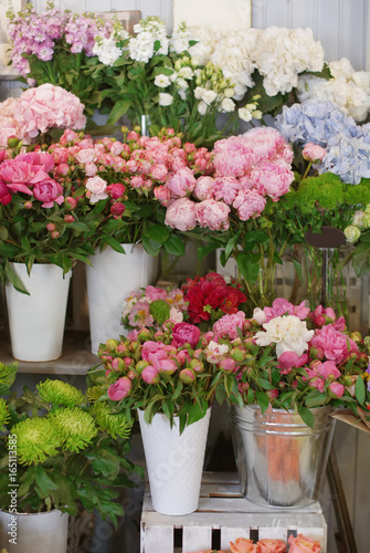 Beautiful peonies and other flowers in shop © Africa Studio