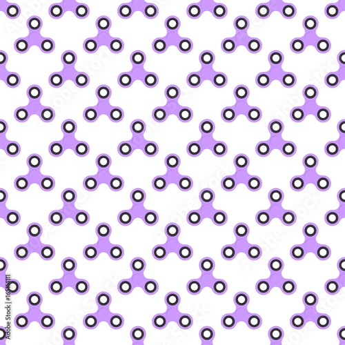 Background from purple children fidget spinners on white background. Playing backdrop of hand twisting toys with bearings in a row next to each other and alternately under him 