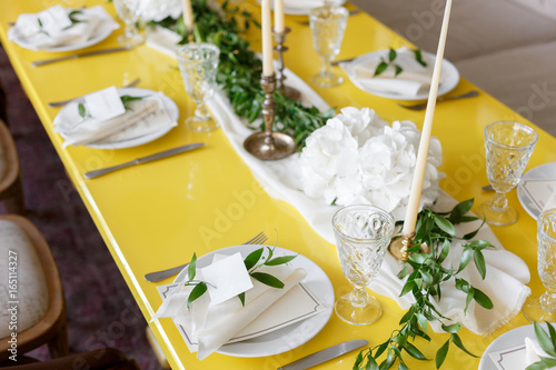 Candles and goblets on a decorated wedding table. selective focus photo