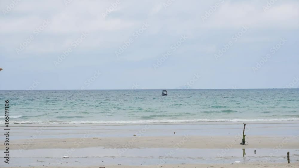 Tropical island sea shore and sky clouds time lapse. Small waves on sea water Tropical island sea shore and sky clouds time lapse. Small waves on sea water