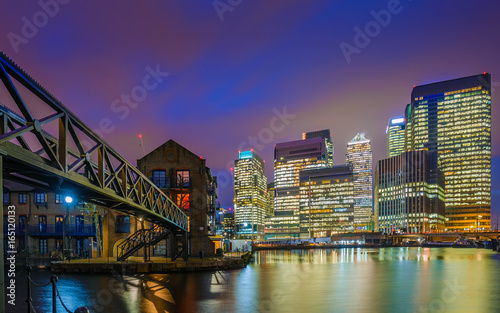 London, England - The skyscrapers of Canary Wharf financial district and residential buildings at the docklands of London by night © zgphotography