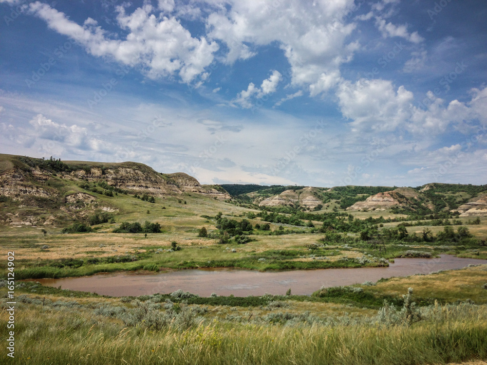 mountains in North Dakota by a river