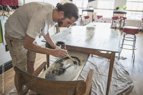 An Artist Doing Commision Work For A Bar/Restuarant photo