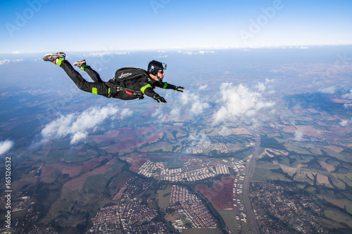 Parachutist in the free-fall, looking at his goal during the jump