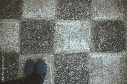 Shoes on chess table black and white 