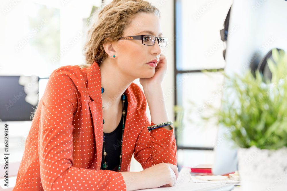 Young woman in office