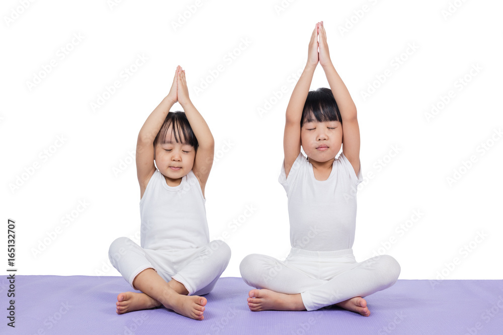 Asian Chinese little girls practicing yoga pose