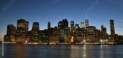 The skyline of downtown New York City and the Financial District at dusk.