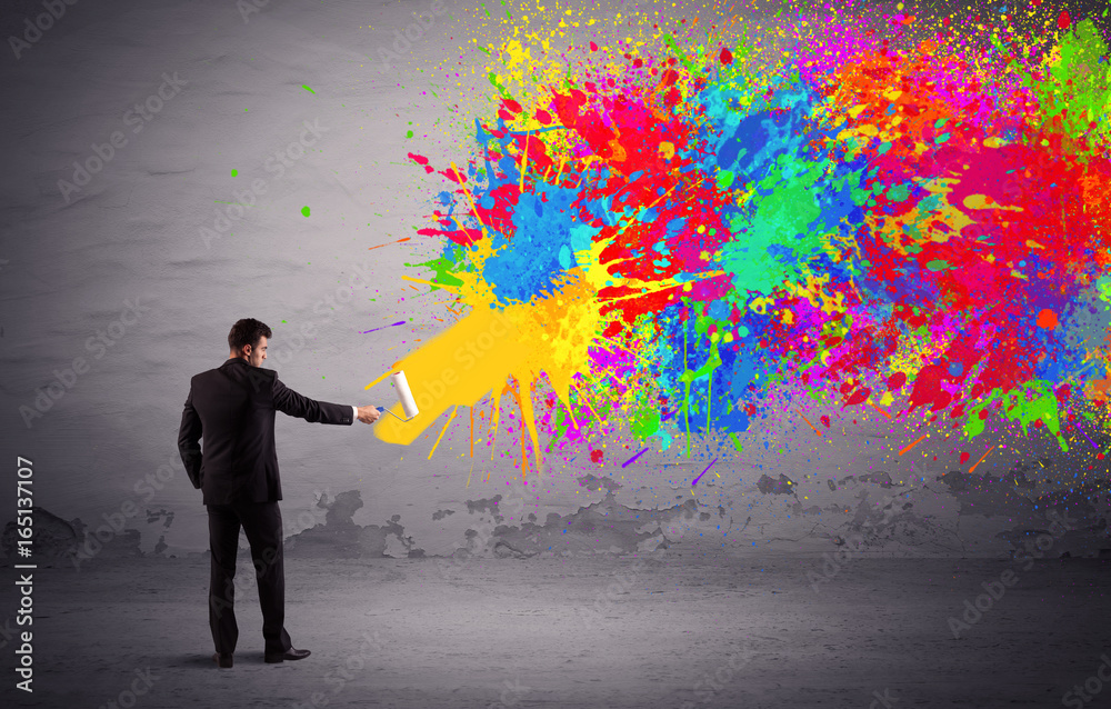 Sales person painting colorful splatter Sales person painting colorful splatter