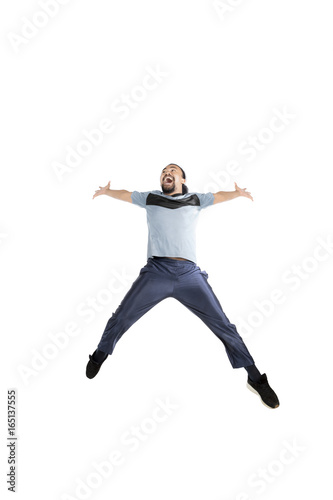 African man with sportswear jumps in studio