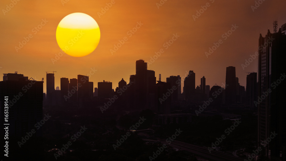 Beautiful golden sun over city skyline