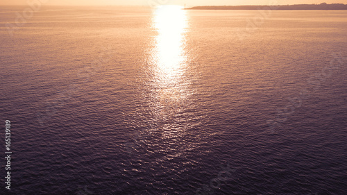Beautiful sunrise with calm sea wave