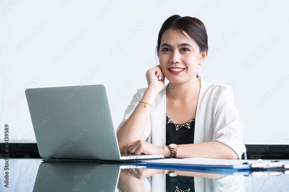 Students college or graduate students are smile and hands on the Chin sitting with laptop and report paper in education concept. Students college or graduate students are smile and hands on the Chin sitting with laptop and report paper in education concept.