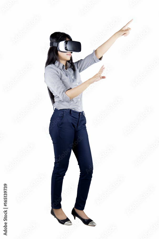 Businesswoman using a virtual reality goggles Businesswoman using a virtual reality goggles