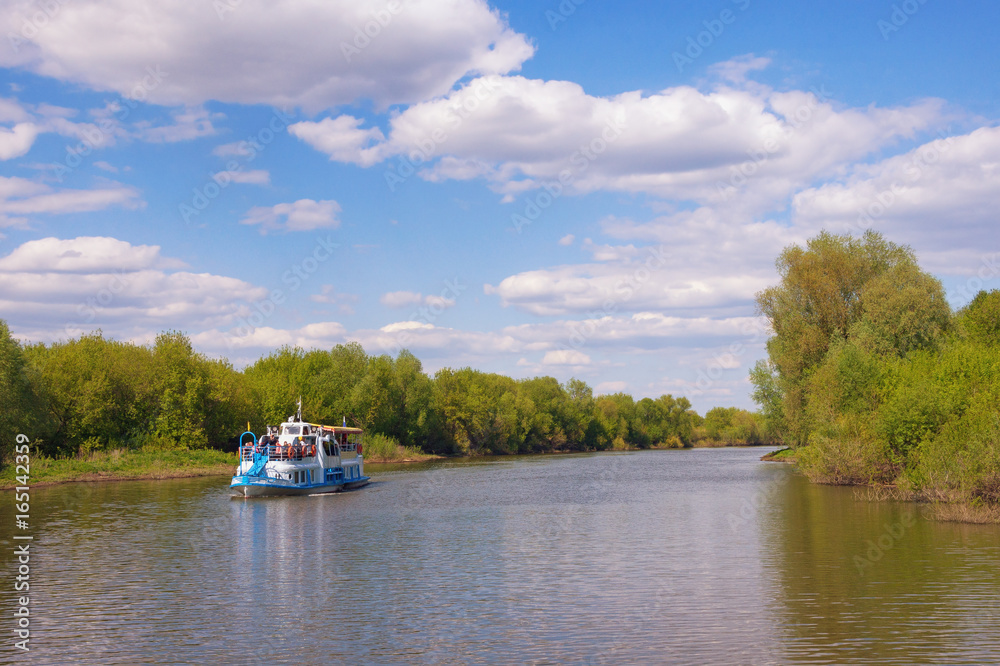 Fototapeta premium Trubezh river with a pleasure boat in the Ryazan region. Central Russia