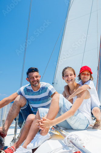 Father with adorable kids resting on yacht © Max Topchii