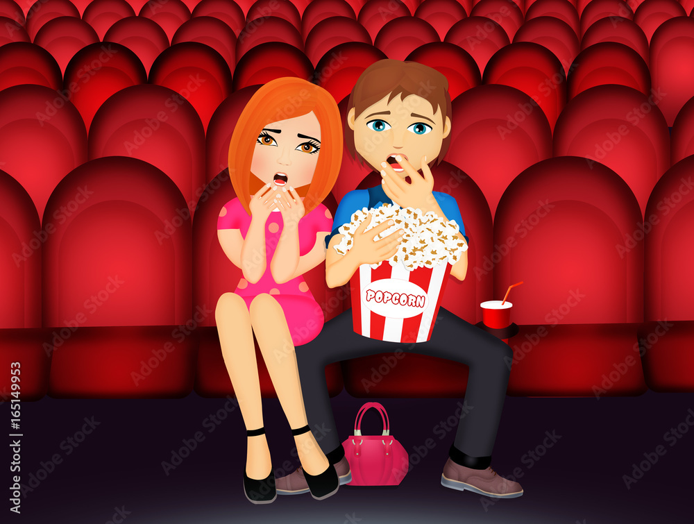 Naklejka premium couple is watching a horror movie in a cinema