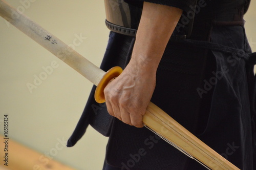 Japanese Man Holding Kendo Sword In His Hand