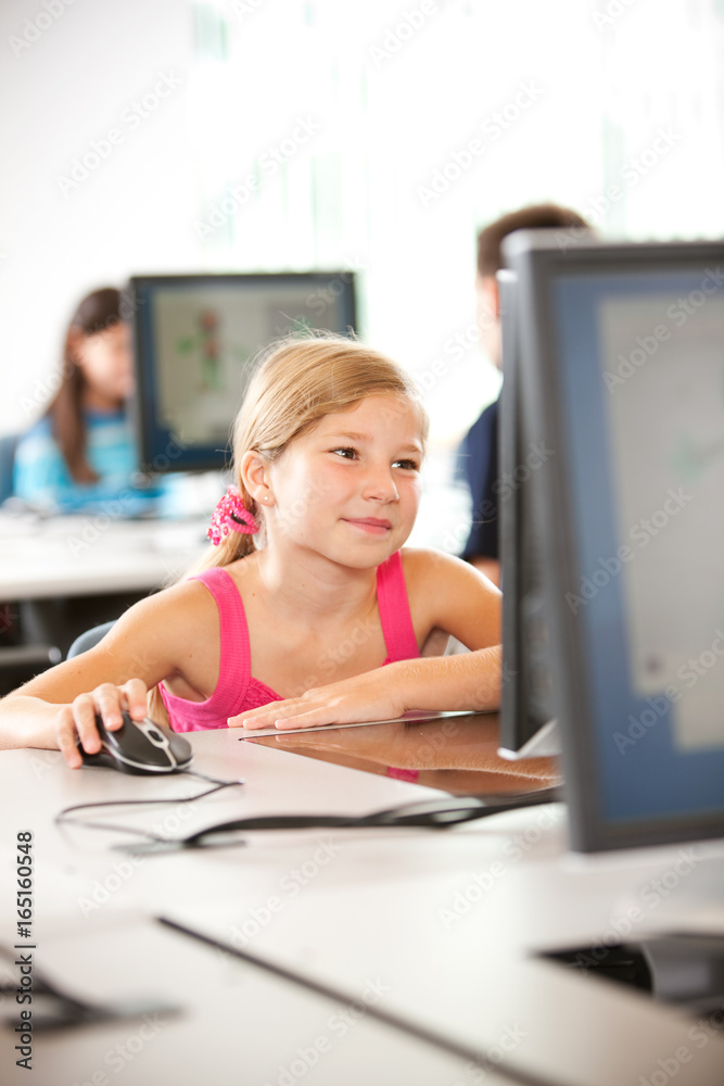 Computer Class: Girl Using Mouse at Workstation Computer Class: Girl Using Mouse at Workstation