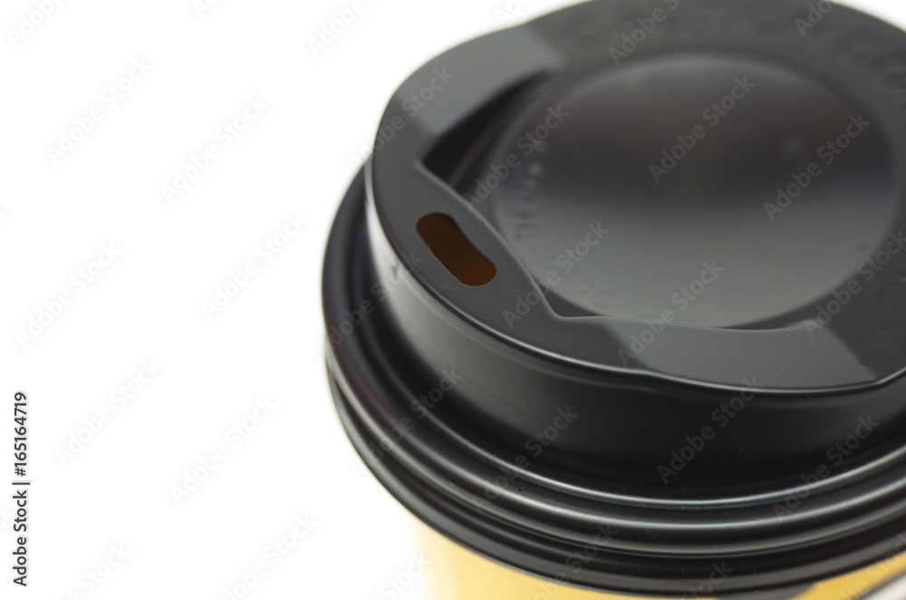 Brown coffee cup with lids black with openings for lifting drinking isolated on white background. Package. Brown coffee cup with lids black with openings for lifting drinking isolated on white background. Package.
