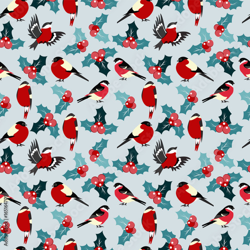 seamless christmas pattern with leaves berries holly and birds bullfinch.