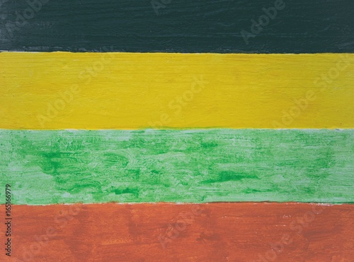 Jamaican reggae colors on wood panel background