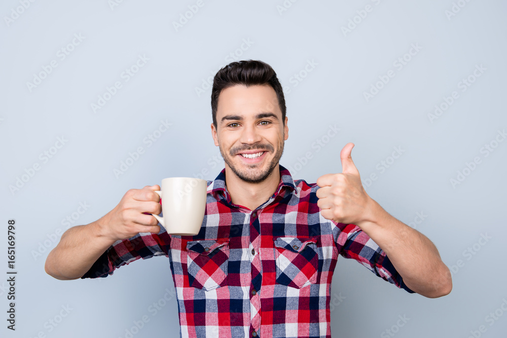 Great job! Very excited young brunet bearded freelancer is gesturing like sign, he finished the project, now it`s coffee time, chill and relax Great job! Very excited young brunet bearded freelancer is gesturing like sign, he finished the project, now it`s coffee time, chill and relax