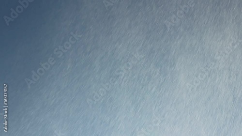 Water droplets on blue sky background. Spray rain. Rain droplets make lens flare.  photo