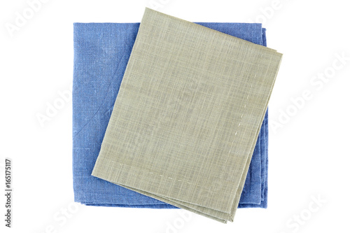 Two folded textile napkins on white