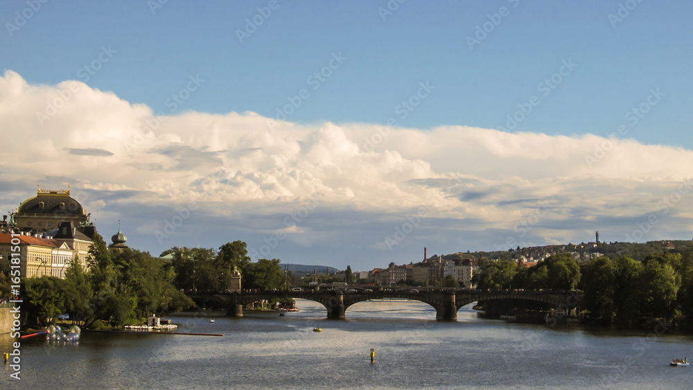 Charles Bridge in Prague with cloudy and blue sky background