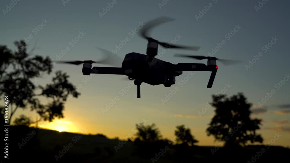 Small quadrocopter flying against the sky. Slow motion Small quadrocopter flying against the sky. Slow motion