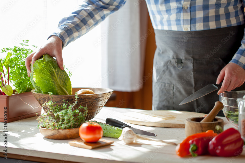 male cooking healthy salad