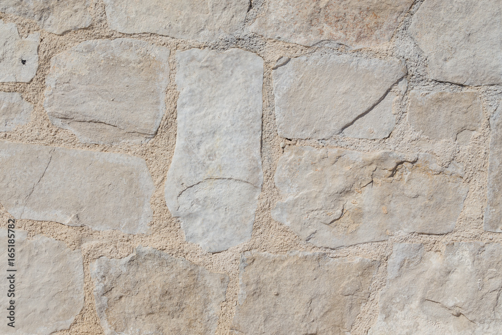 Pattern of the ancient style stone wall with cement.