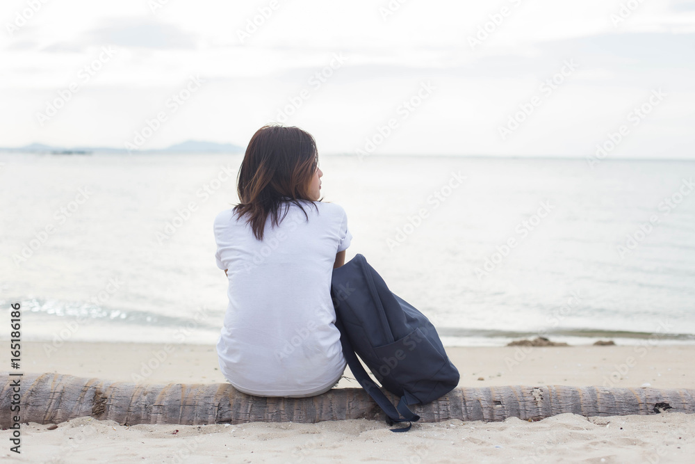 Sad lonely beautiful woman sitting on the pier Sad lonely beautiful woman sitting on the pier