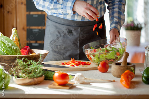 male cooking healthy salad