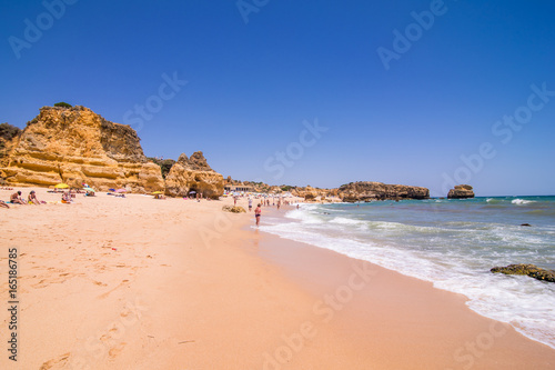 Beautiful view of sand beaches with rocks washed by Atlantic ocean on sunny summer days. summer vocation concept