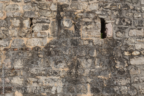 Pattern of the ancient style stone wall with cement.